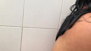Luscious Latina lays down for sultry solo sesh in the bathroom stall