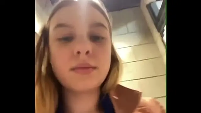 Exposed woman self-pleasure in open space