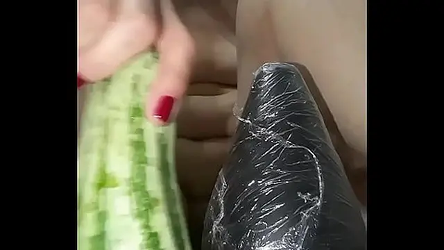 The bitch isn′t content with just b  &mdash;  she loves to bust her tail in a big thick zucchini until the edge of her ass is loose
