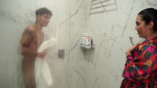 Big-assed stepmom ends up fucking her skinny stepson after spying on him in the shower
