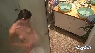 Busty Kecy displays off in the shower