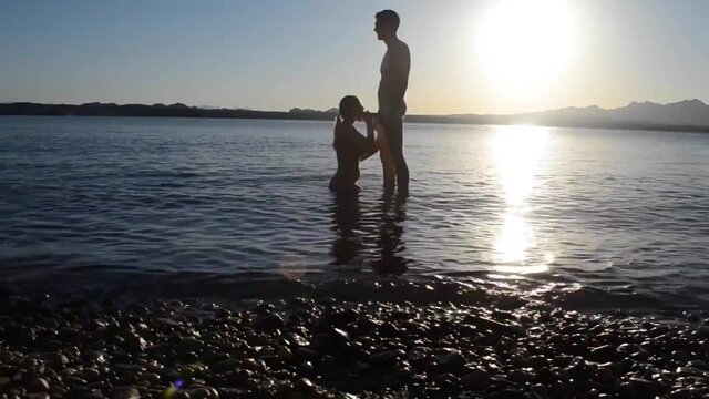 Public stunner gets pounded in doggystyle by bigcocked dude on the beach