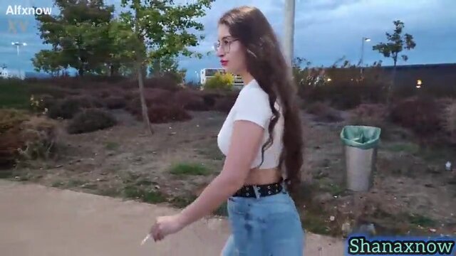 Brunette goddess with a huge booty shows off her round rear in clenching jeans