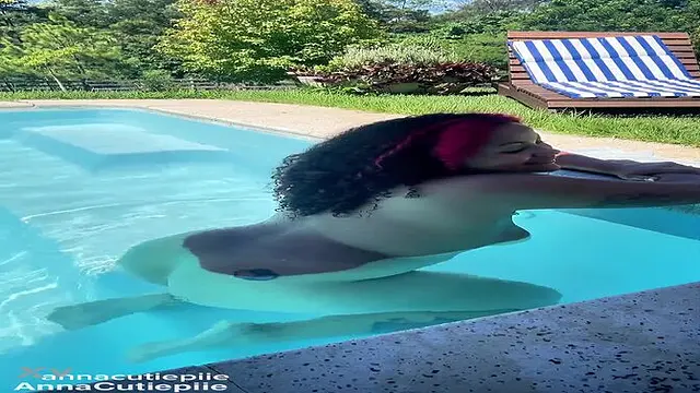 Naked Latina babe has a big booty and goes swimming in the pool 